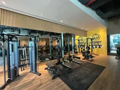 a gym with several treadmills and machines in a room at Infinity Pool & Private Beach 1BR Palm Jumeirah in Dubai