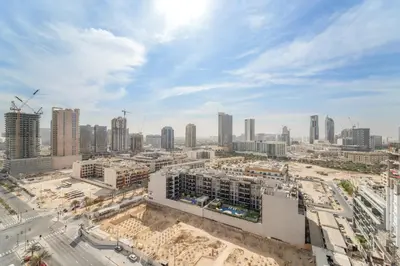 an aerial view of a city with tall buildings at VayK - Contemporary One Bedroom Apartment in JVC in Dubai