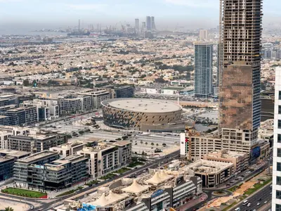 an aerial view of a city with buildings at Aurora - 2BR Paramount Hotel Midtown Dubai, Skyline & Burj Khalifa View in Dubai
