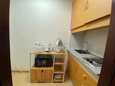 a small kitchen with a sink and a counter at Studio in discovery garden Near gardens metro station in Dubai