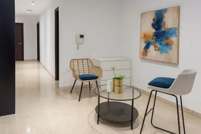 a living room with two chairs and a table at Cloud 9 Room Marina in Dubai