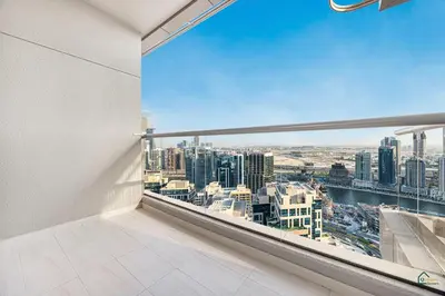 an empty room with a view of a city at Spacious & cozy Studio in Downtown! in Sabkhah