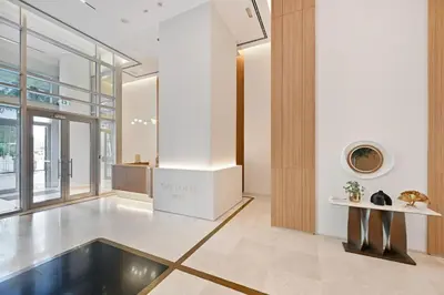 a living room with a fireplace and a table at Modern 1 Bed in the Heart of Downtown 5 mins walk from Burj Khalifa and Dubai Mall in Dubai