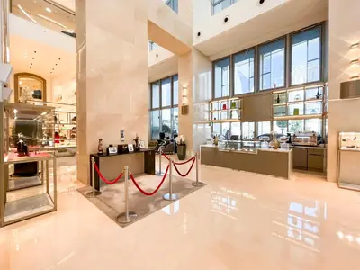 a large kitchen with a red rope on the floor at Luxurious 1 BR Apt Kempinski Central Avenue in Dubai