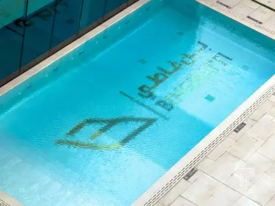 a swimming pool with the word no written on it at Brand New Luxe Studio Sauna, Gym&Pool With Access in Dubai