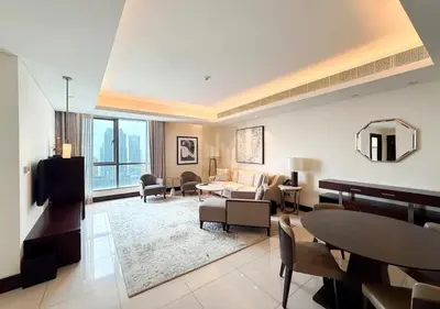 a living room with a couch and a table at Dubai Mall Luxury 1Bed The Address in Dubai