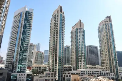 a group of tall buildings in a city at Minteh Holiday Home in Dubai