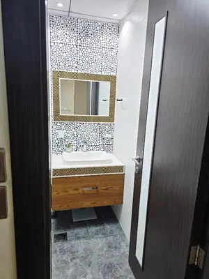 a bathroom with a sink and a mirror at Bayz by Danube by That Place Home Living in Dubai