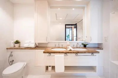 a bathroom with two sinks and a mirror at Elite Royal Apartment - Full Burj Khalifa & New Fountain View - Panoramic - Luxurious - Magnus in Dubai