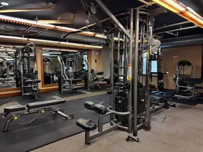 a gym with lots of exercise equipment in it at 2 BR with Full Burj View 10 min Walk to Dubai Mall in Dubai
