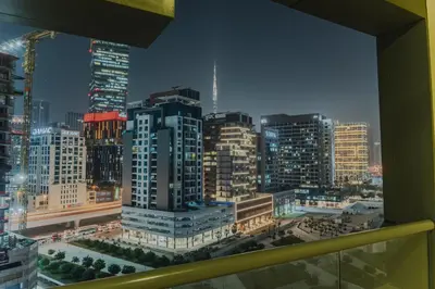 a view of a city skyline from a window at C&L Homes with Burj Khalifa view in Dubai