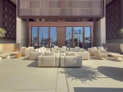 a rendering of a lobby with white couches and tables at Ultra Luxury 2BD Beachfront & Panoramic Sea Views in Dubai
