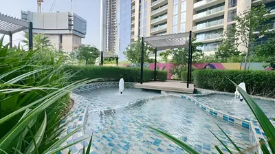 a pool of water with a gazebo in a city at Stunning 2 Bedroom Aykon City Tower C in Dubai