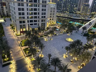an aerial view of a city with palm trees and buildings at Luxury 1BR I Creek Beach I Pool & Beach in Dubai