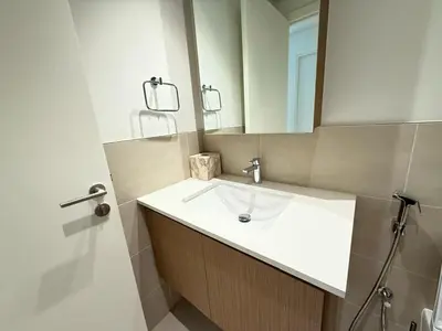 a bathroom with a sink and a mirror at Luxury 1BR I Creek Beach I Pool & Beach in Dubai