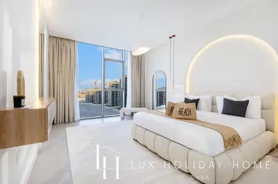 a bedroom with a large bed and a large window at LUX The Burj Khalifa Lagoon View Suite 5 in Dubai