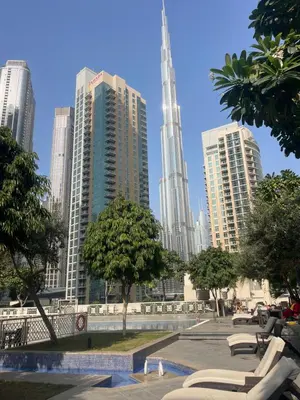 a view of a city with tall buildings at Burj Khalifa District Luxury Apartment - Downtown Dubai in Dubai
