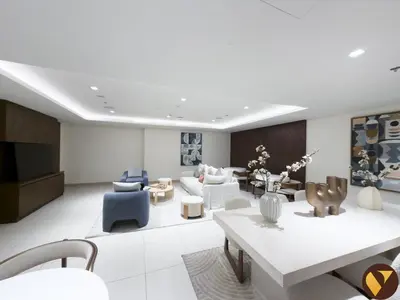 a living room with a couch and chairs and a tv at Vogue Creek Harbour Edge Tower Waterfront Living Close to Downtown, Burj Khalifa and Dubai Mall, One Bedroom Apartment with Balcony and Canal View, Access to all Amenities in Dubai