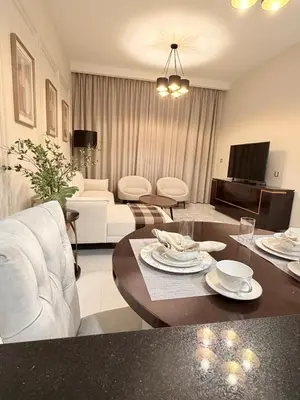 a living room with a couch and a table at Luxury Living In JVC in Dubai