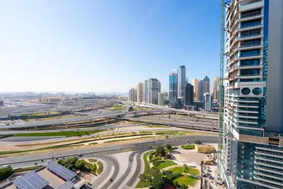 a view of a city with tall buildings and highways at Modern 1 BHK Retreat in Lakeside JLT in Dubai
