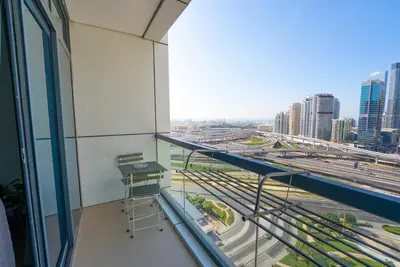 a balcony in a building with a view of a city at Modern 1 BHK Retreat in Lakeside JLT in Dubai