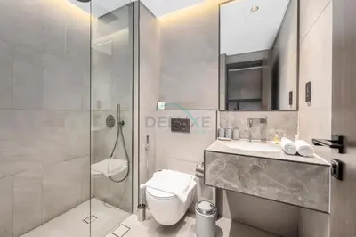 a bathroom with a shower and a toilet and a sink at Studio Just Minutes Drive to Downtown Dubai Top Attractions, Close to Zabeel Stadium, O10 Building, Al Jaddaf by Deluxe Holiday Homes in Dubai