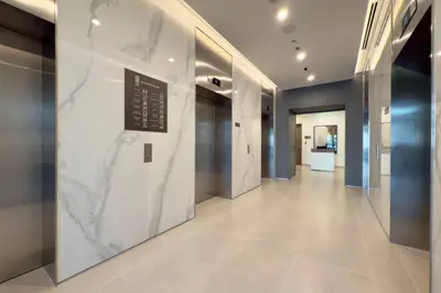 a hallway in a building with a marble wall at Modern 1 Bed Apartment with full Dubai Marina view in Dubai