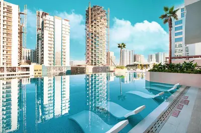 a swimming pool with a view of the city at Binghatti Phantom! Private Pool in Your Balcony! 5 Star Hotel Amenities! in Dubai