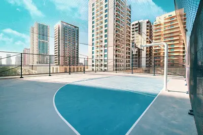 a tennis court on a balcony with tall buildings at Binghatti Phantom! Private Pool in Your Balcony! 5 Star Hotel Amenities! in Dubai
