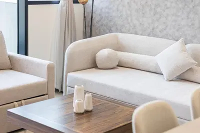 a living room with a couch and a coffee table at Binghatti Phantom! Private Pool in Your Balcony! 5 Star Hotel Amenities! in Dubai