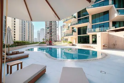 a swimming pool in the middle of a building at Binghatti Phantom! Private Pool in Your Balcony! 5 Star Hotel Amenities! in Dubai