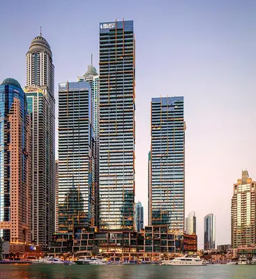 a group of tall buildings in a large city at Dubai Marina Luxury 1 BDR Holiday Apartment - Dubai Marina Walk in Dubai