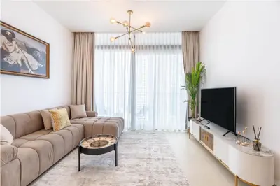 a living room with a couch and a flat screen tv at Dubai Marina Luxury 1 BDR Holiday Apartment - Dubai Marina Walk in Dubai