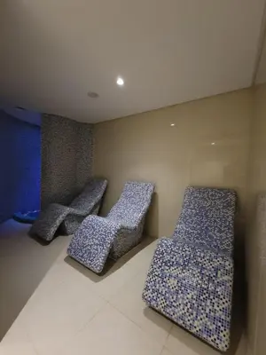 two chairs sitting next to each other in a room at Downtown Dubai Burj Khalifa View 2 BHK Dubai Mall in Dubai