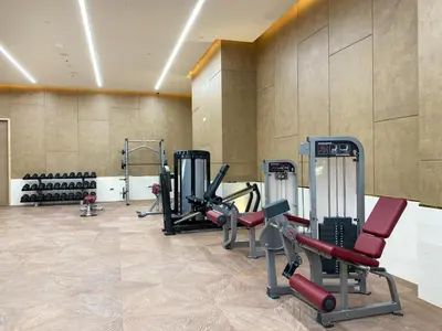 a gym with several treadmills and exercise bikes at Luxe Island Retreat 1BR in Palm-14 in Dubai