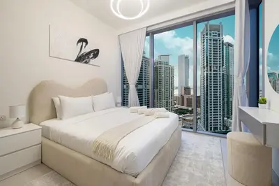 a bedroom with a large bed and a large window at Marina High-Floor Premium Luxury Stay at LIV Marina for up to 9 Guests with Marina Views and Exceptional Amenities in Dubai