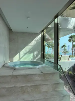 a building with a jacuzzi tub on the stairs at 1 BR apartment in Ellington Beach House in Dubai