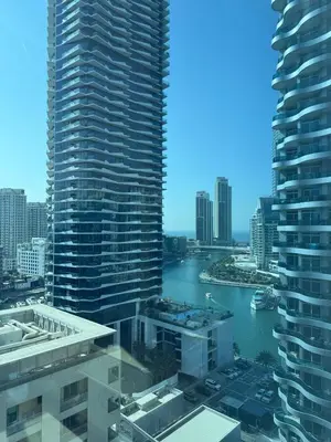 a view of a river in a city with tall buildings at Dubai Marina 5 min to the beach in Dubai