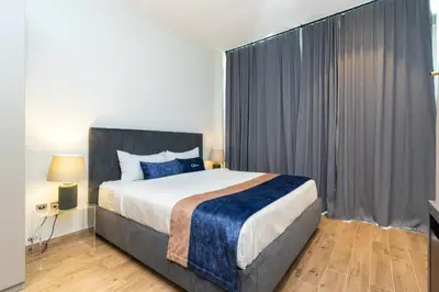 a bedroom with a large bed in a room at CitiHome - Luxurious Marina View - Jumeirah Living in Dubai