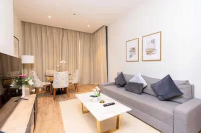 a living room with a couch and a table at CitiHome - Elegant Retreat in Dubai Marinas Heart in Dubai
