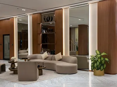 a lobby with two couches and a table at 2BR Luxury, 2,5 bath, Baby bed, Gym & Pool in Dubai