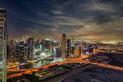 a city skyline at night with traffic at 3 bedroom 51st floor Panoramic ocean views in Dubai