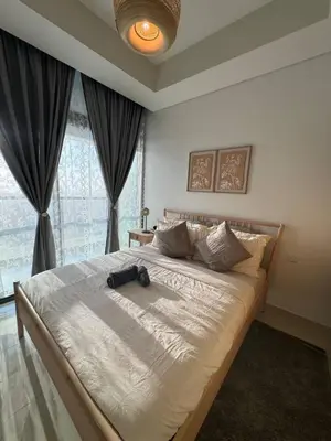 a bedroom with a large bed with a large window at 3 bedroom 51st floor Panoramic ocean views in Dubai
