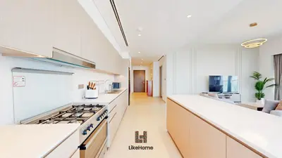 a kitchen with white cabinets and a stove top oven at Direct Burj Khalifa views Lux Sky Manson Like Home in Dubai