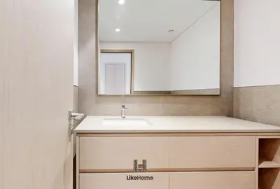a bathroom with a sink and a mirror at Direct Burj Khalifa views Lux Sky Manson Like Home in Dubai