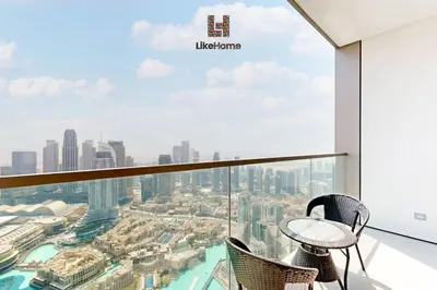a view from the top of a building with a table and chairs at BEST BURJ VIEW IN DUBAI DOWNTOWN 2BR in Dubai