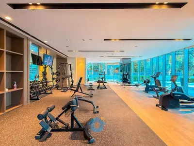 a gym with treadmills and exercise equipment in a room at NEXT TO DUBAI MALL AND BURJ 2 BR SEA VIEW in Dubai