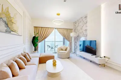 a living room with a couch and a tv at NEXT TO BURJ AND DUBAI MALL 2 BR BEST LOCATION in Dubai