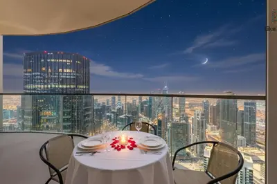 a table with a lit candle on top of a room at NEXT TO BURJ AND DUBAI MALL 2 BR BEST LOCATION in Dubai