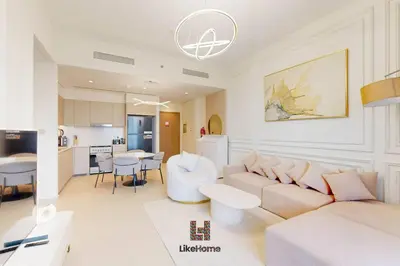 a living room with a couch and a table at NEXT TO BURJ KHALIFA AND DUBAI MALL in Dubai